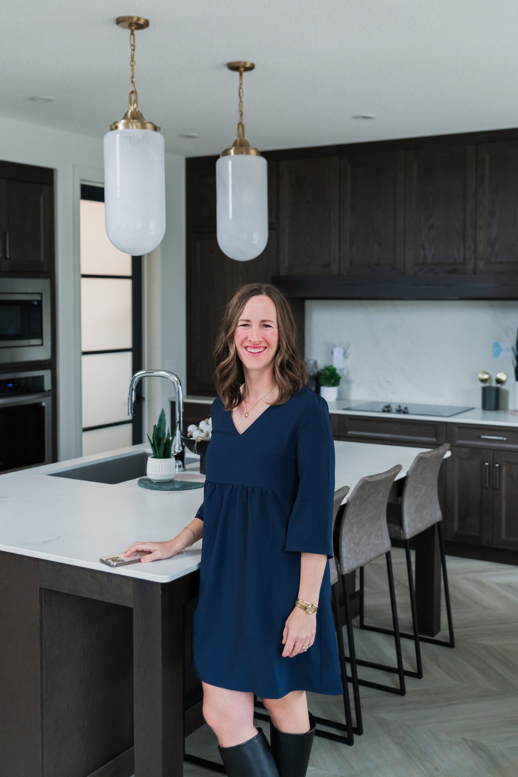 Ashley Tichkowsky standing in one of the houses she has sold.