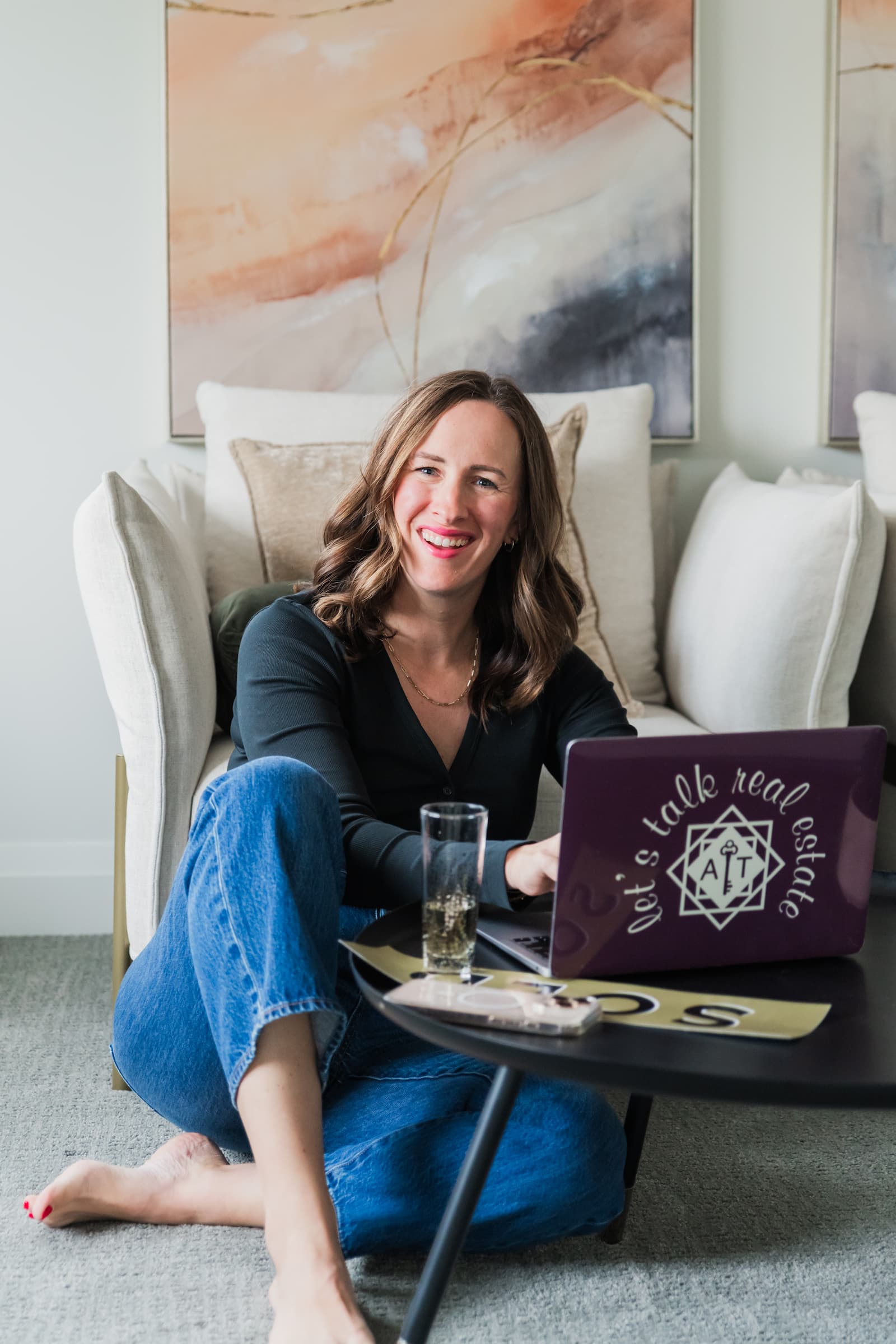 Ashley Tichowsky - Licensed REALTOR® working on laptop